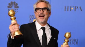He's holding Golden Globes in this one, but we're pretty sure he got the Oscar too