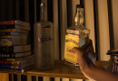 Triumphant Freshman Adds Another Empty Alcohol Bottle to Windowsill