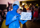 “This Will Go Over Great!” Says White Guy Dressed For Halloween As Smurf with ‘Blue Lives Matter’ Sign